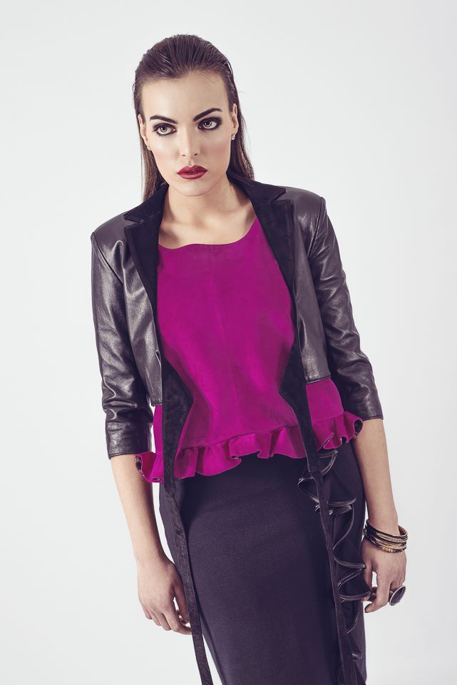 Suede peplum top in magenta worn with ballet style leather jacket in black.